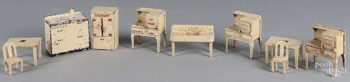 Ten pieces of Arcade cast iron dollhouse furniture, tallest - 4''.