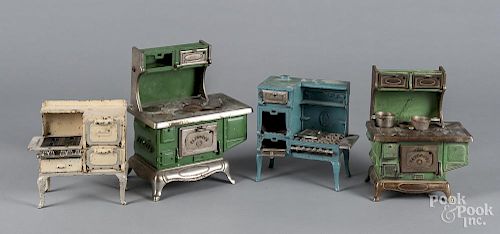 Four cast iron toy stoves, to include three Kenton and one Arcade, tallest - 11'' h.