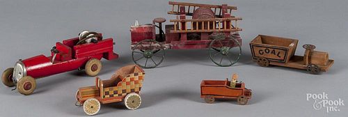 Five wooden cars, to include a small painted putz car with composition driver, a Coal truck, two l