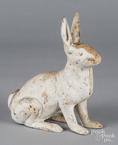 Cast iron rabbit doorstop, together with a duck pull toy, 11'' h.