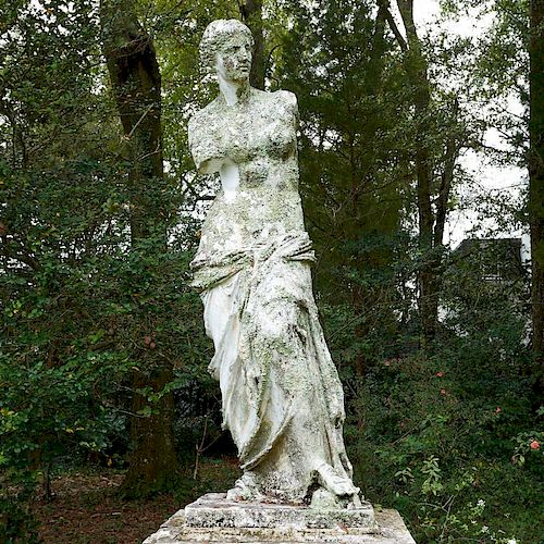 Life-size antique cast iron garden figure
