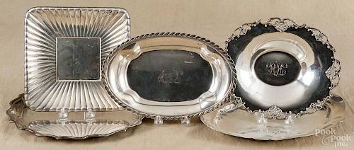 Five sterling silver trays, early 20th c., of various makers, largest - 12'' dia., 74.6 ozt.