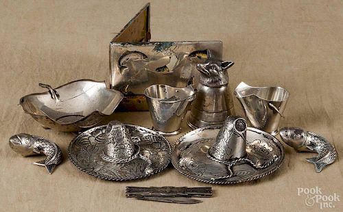 Group of decorative silver table accessories, to include a stirrup cup, fish-form shakers, etc.
