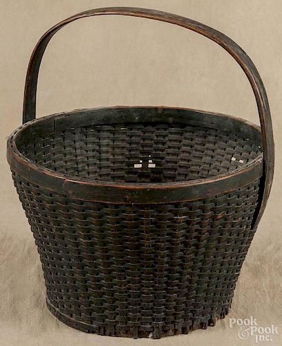 Painted split oak basket, late 19th c., retaining an old green surface, 12 1/4'' h., 11 1/4'' w.