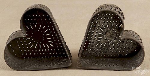 Two tin heart-shaped cheese strainers, 19th c., 3 1/4'' h., 5 3/4'' w., 5 3/4'' d.