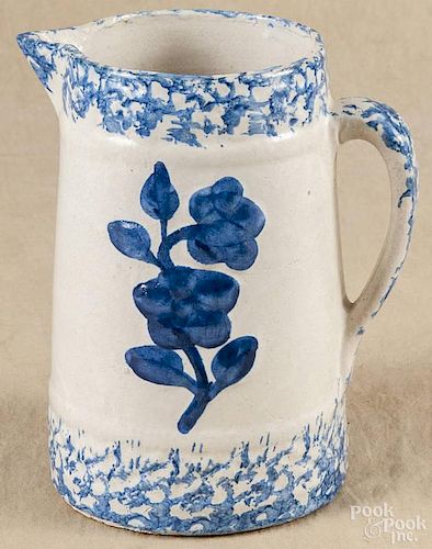 Blue and white spongeware pitcher, 19th c., with relief floral decoration, 9'' h.