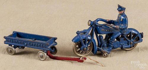 Champion cast iron police motorcycle, 20th c., 7'' l., together with a Champion Express wagon