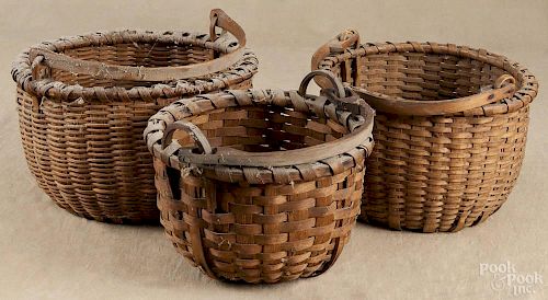 Three split oak swing-handled baskets, late 19th c., 8'' h.