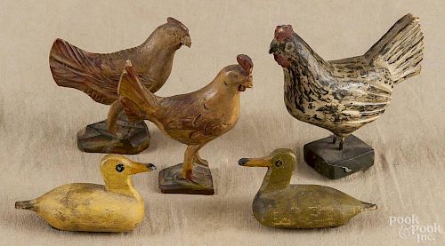 Three carved and painted roosters, 19th c., together with two ducks, tallest - 3 7/8''.