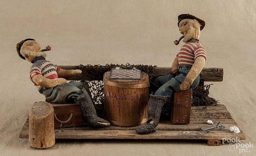 Wood and cloth folk art group, early 20th c., of two sailors playing checkers, 8'' h., 15 1/2'' w.