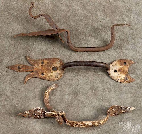 Three wrought iron thumb latches, early 19th c., 11 1/2'' h., 10 1/2'' h., and 10'' h.