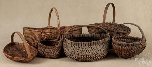 Six assorted split oak baskets, largest - 13'' h., 19'' w.