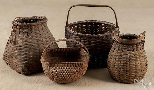 Split oak kitten's head basket, late 19th c. 9 1/2'' h., 8 1/2'' w., together with three other baskets
