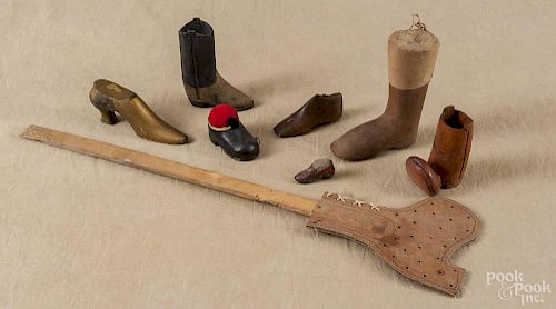 Group of shoe-form accessories, to include a pincushion, a tape measure, a swatter, etc.