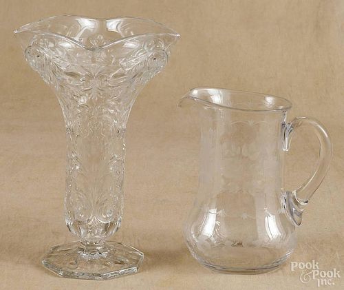 Heisey etched glass vase, 10 1/2'' h., together with a pressed glass vase, 11'' h., and a pitcher