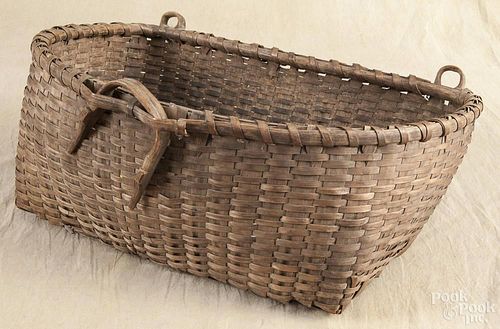 Split oak gathering basket, late 19th c., with bentwood strap loops, 8'' h., 21'' w.