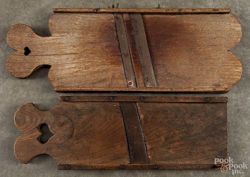 Two Pennsylvania walnut slaw boards with heart cutout ends, 19th c., 19'' h. and 21'' h.