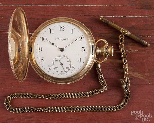 Elgin 14K gold pocket watch, with hunting case, #9845521, and a gold-filled watch chain.