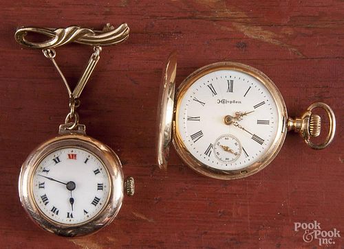 Two ladies gold pocket watches, to include a Hampden pocket watch and a Rolex lapel watch.