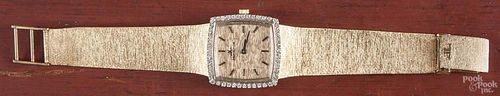 Ladies 14K yellow gold Jaeger - LeCoultre wrist watch, the face surrounded by single cut diamonds