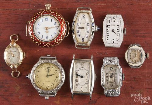 Eight ladies wrist watches, no bands, of various metals, stones, enameled, etc.