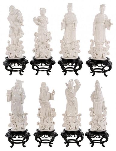 Eight Blanc de Chine Standing Figures on Stands