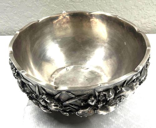 Large, silver-plated bowl with relief decoration of leaf and flowers