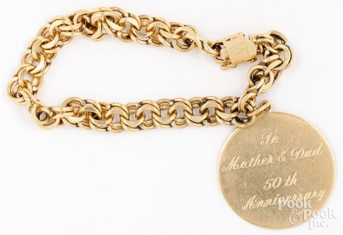 14K yellow gold bracelet with 14K gold charm