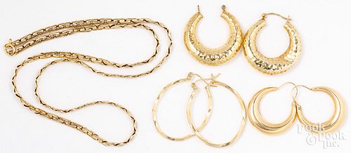 Three pairs of 14K gold hoop earrings, necklace