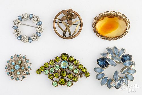 Six costume jewelry brooches