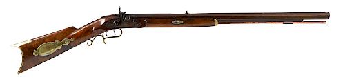 Half stock percussion rifle, approximately .36 caliber, having a walnut stock with brass furniture
