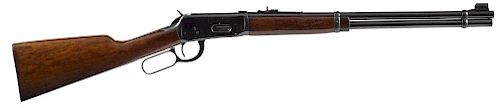 Winchester model 1894 lever action carbine, .30-.30 caliber, pre 1964, having a walnut stock with