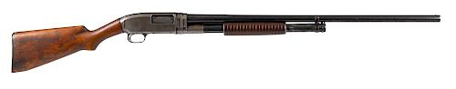 Winchester model 12 slide action shotgun, 12 gauge, having walnut stocks, with 30'' round barrel. S