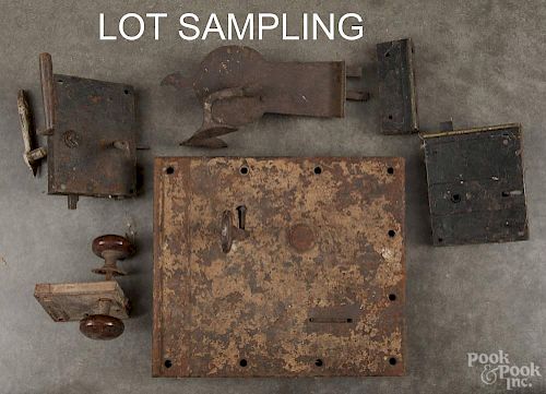 Large collection of antique iron door locks.