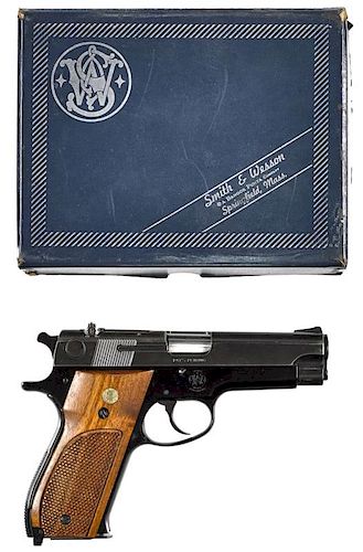 Smith & Wesson model 39-2 semi-automatic pistol, 9 mm, blued, with walnut grips and a 4'' round bar