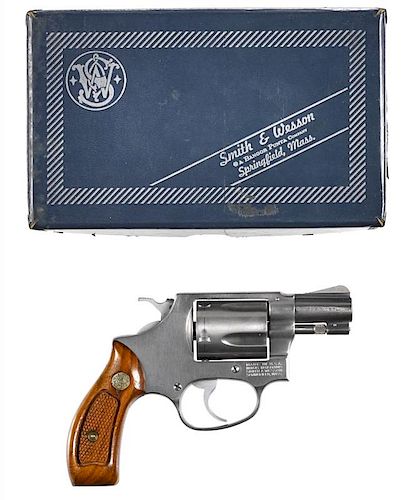 Smith & Wesson model 60, five-shot revolver, .38 special caliber, stainless steel with walnut grip