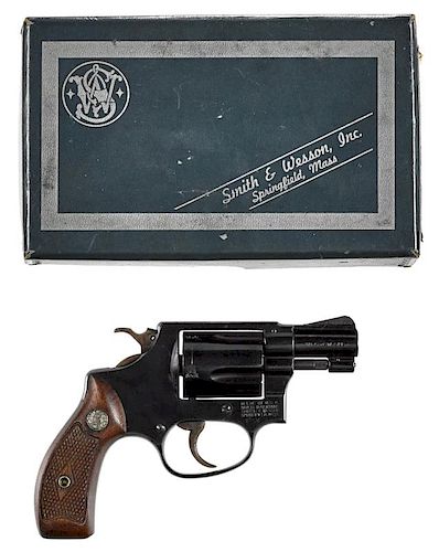 Smith & Wesson model 36, five-shot revolver, .38 special caliber, blued with walnut grips and a 2''