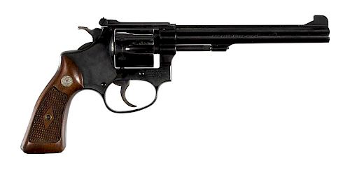 Smith & Wesson model 17 six shot revolver, .22 LR caliber, with a blued finish, walnut grips, and