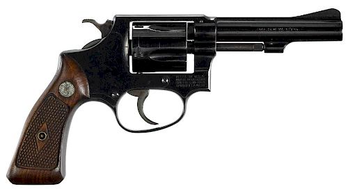 Smith & Wesson model 33-1 revolver, .38 S & W caliber, with walnut grips and 4'' round barrel. SN#