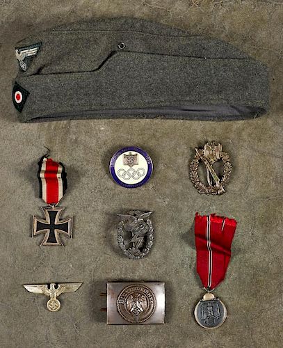 Group of men's WW II German medals, together with a Luftwaffe enlisted mans cap and a Hitler youth