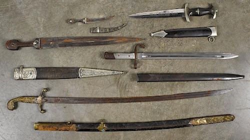Five edged weapons and scabbards, to include a reproduction German WW II SS dagger and three North