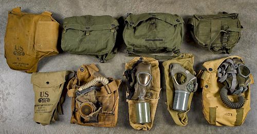 Nine U.S. Military gas masks, all with original bags.