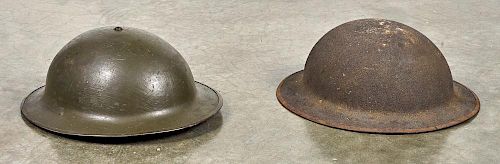 Two US WW I doughboy helmets, one stamped under rim ZD 176.