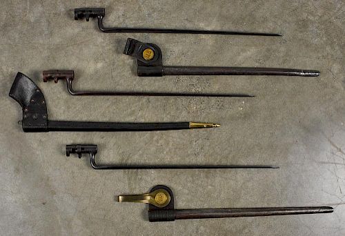 Three US socket bayonets with scabbards, to include one US model 1855/70 and two US Model 1873.