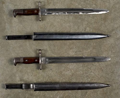 Two US Krag bayonets and scabbards, dated 1899 and 1903.