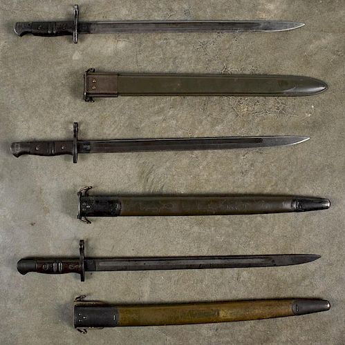 Three edged weapons, to include three US 1917 Enfield bayonets and scabbards, two Remington and one