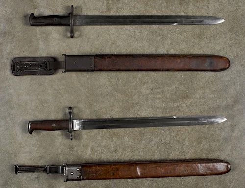 Two US Model 1905 bayonets and scabbards, one inscribed R.I.A. 1906 and the other inscribed S.A