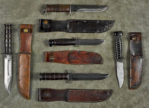 Five WW II era knives, to include a U.S.N. Mark I Colonial deck knife with sheath and hard rubbe
