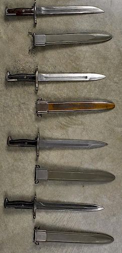 Four US M1 bayonets with scabbards