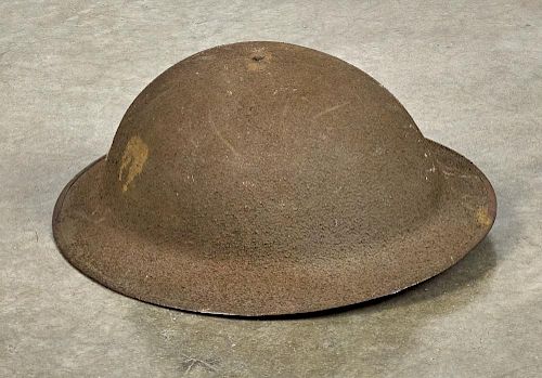 U.S. WW I Brodie helmet, with sand finish, the underside of rim stamped ZE59, with liner and chi